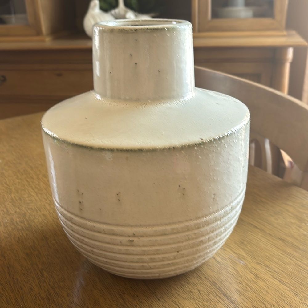 Cream ceramic vase.  10 inches high.  26 inch circumference.
